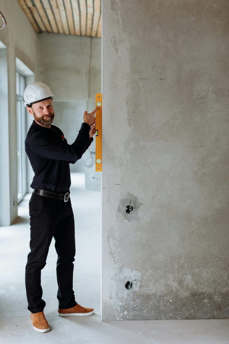 Man using a level tool