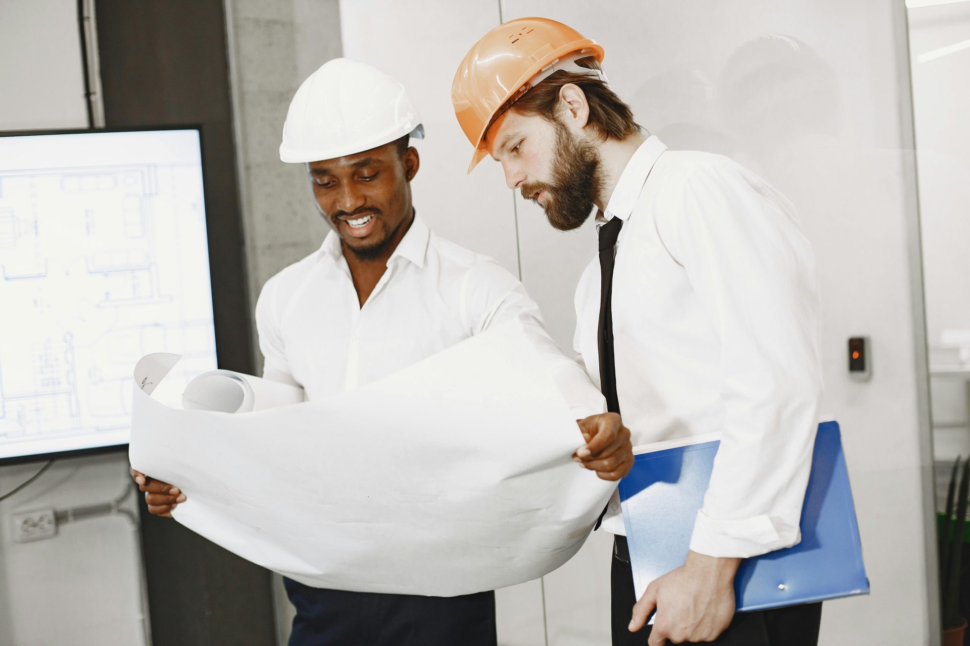 Two men reviewing blueprints